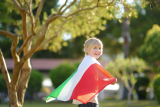 10May2024_Italian_corporates_improving_climate_transparency_and_strategies_-_Industry_roundup_cute-little-child-holding-big-italian-flag-sunny-s-2023-11-27-05-11-29-utc1.png