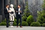 robot-with-businessmen-on-the-street-near-the-buil-2023-11-27-05-11-58-utc.jpg